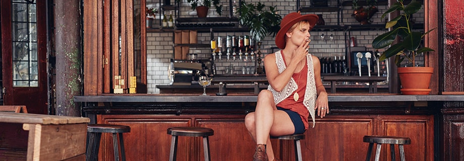 Young woman with hat smoking in a bar. Will smoking one joint show up in a drug test? ill second hand smoke show up on a drug test? Can you fail a drug test just because you were in a room where a joint was smoked?