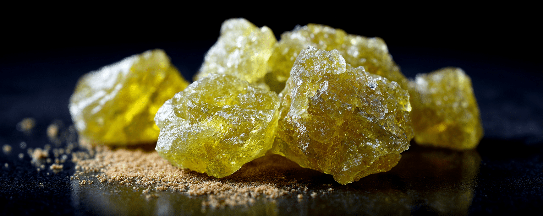 THC diamonds against black background Close up shot of THC diamonds against a black background.